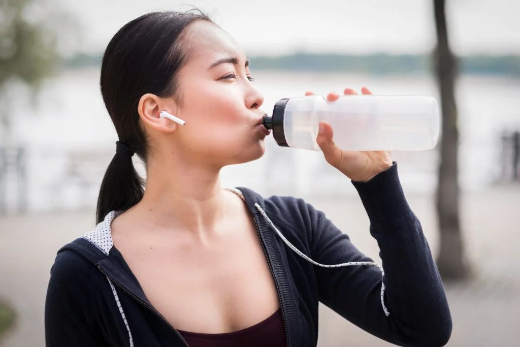 close-up-young-woman-drinking-water-1024x683