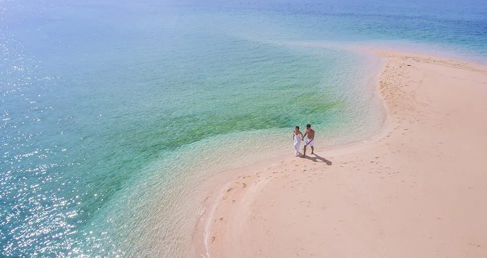 Sandbar near Astoria Palawan—shoreline with crystal-clear waters